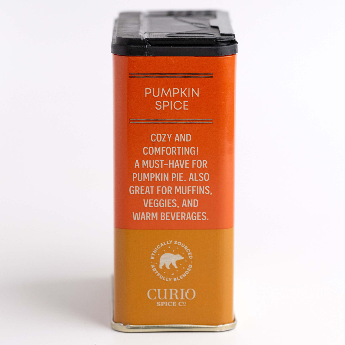 Orange spice container with text on a white background