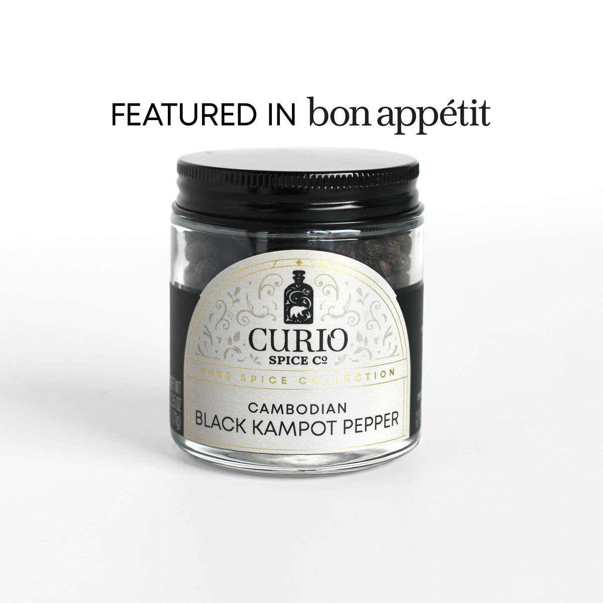 Curio Spice Co. fair-trade single origin sustainable Cambodian Black Kampot Pepper in a glass jar, as featured in Bon Appetit.