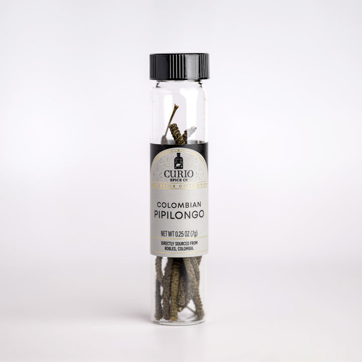 Curio &amp; Co. pipilongo pepper bottle with label on a white background