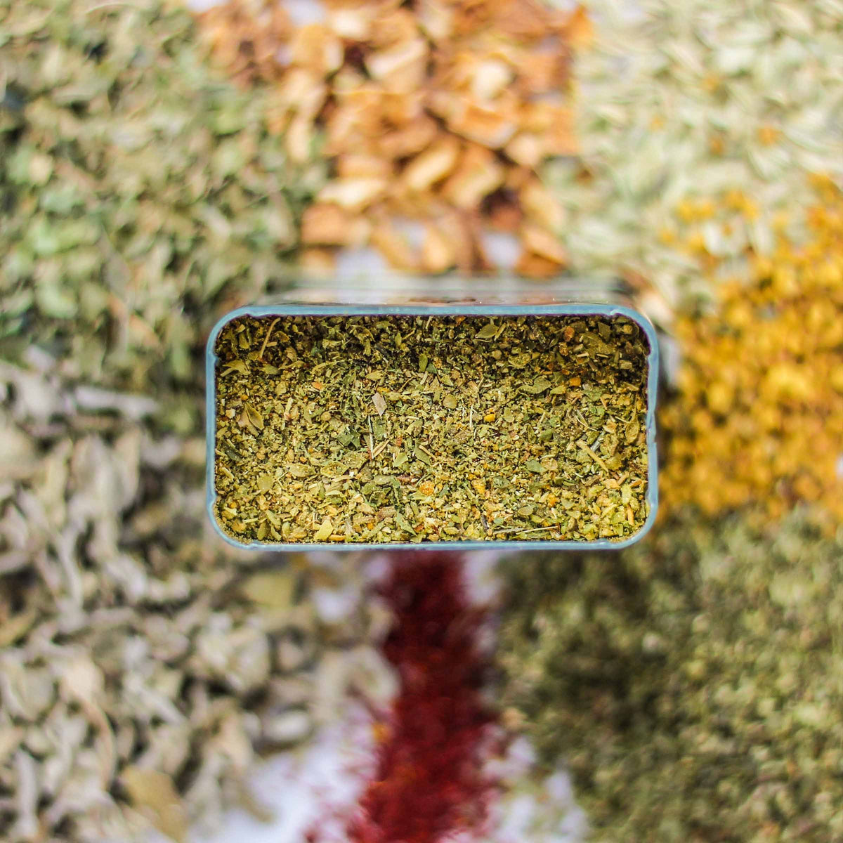Top-down view of Kozani Spice, with fennel, lemon peel, bee pollen, and more.