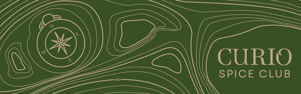 Curio Spice Club logo with compass design on a green background
